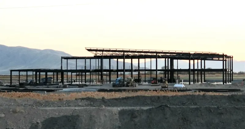 Exposed fabricated steel building frame under construction