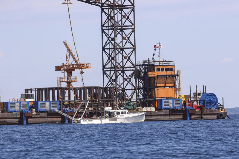 Offshore cable installation equipment and cable reel on a work barge